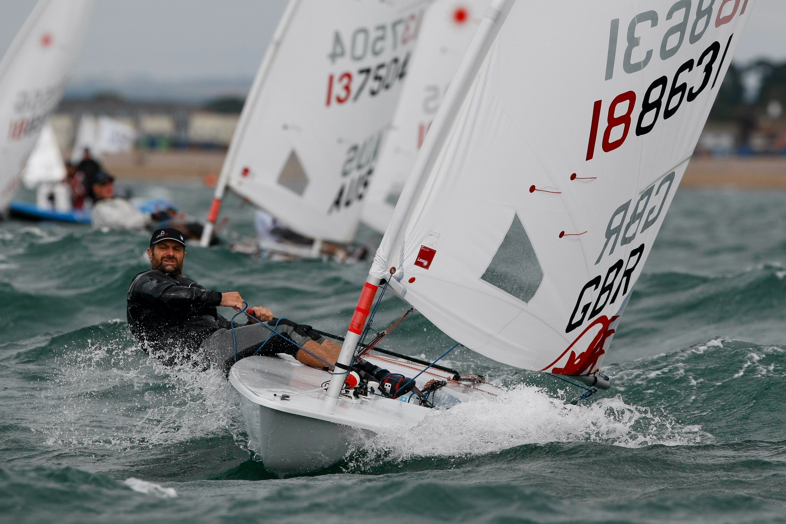 Laser sailing top