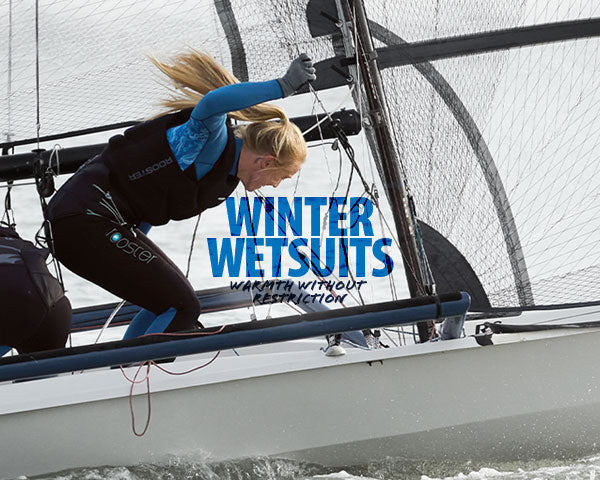 Person in a wetsuit on a sailboat with 'Winter Wetsuits' text overlay.